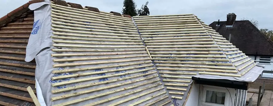 Hip roof stripped back and re-battened over breathable membrane, ready for tiles
