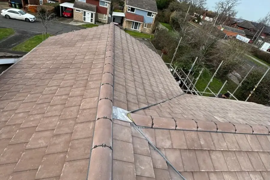 Finished roof in Hertford with new brown tiles and ridge